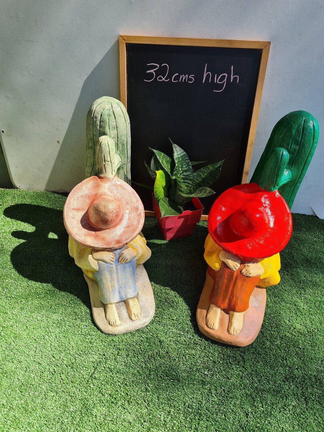 Concrete Mexican attached to Cactus