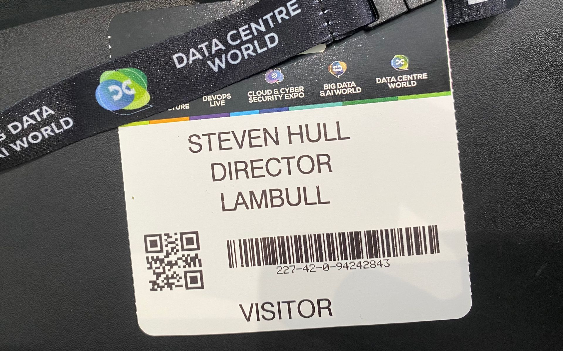 A crowded interior venue featuring a large 