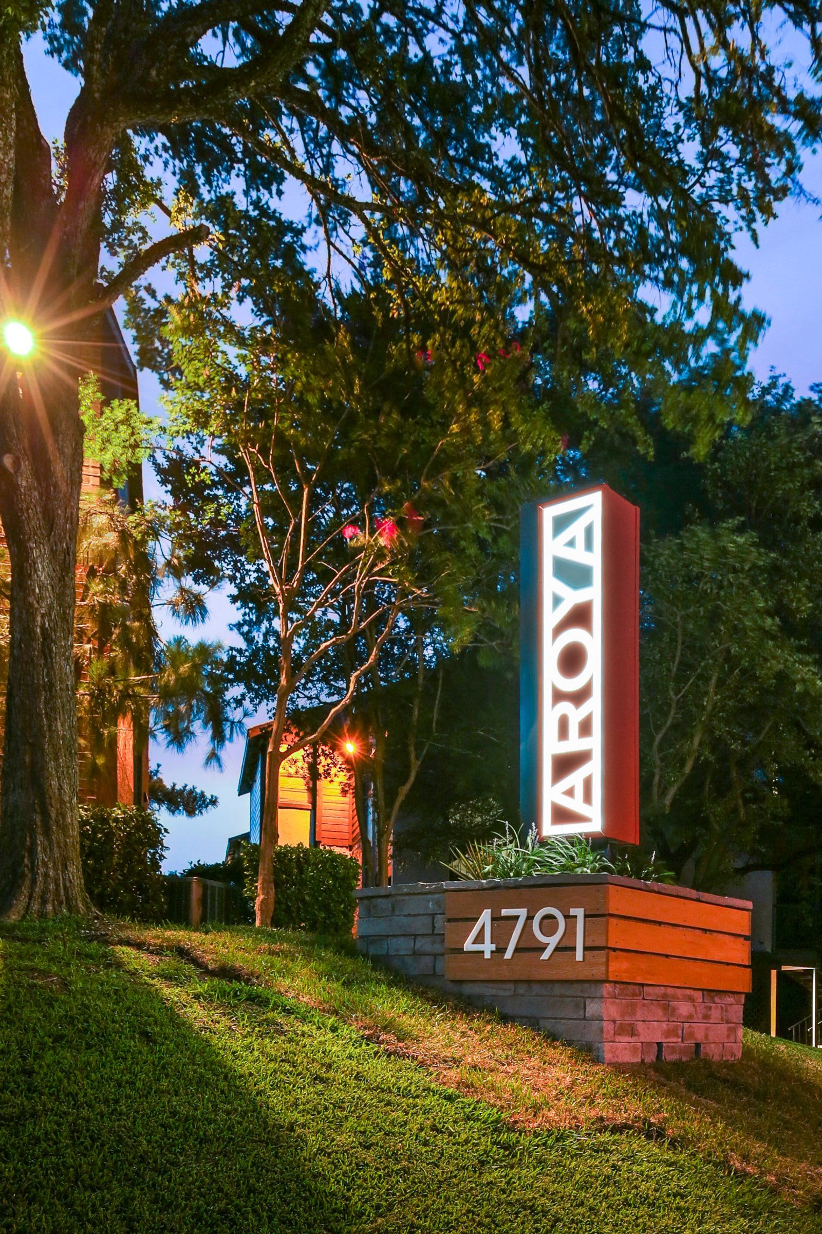 Sign for AROYA apartments with address 