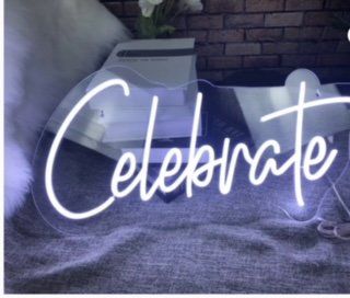 A neon sign that says celebrate on it