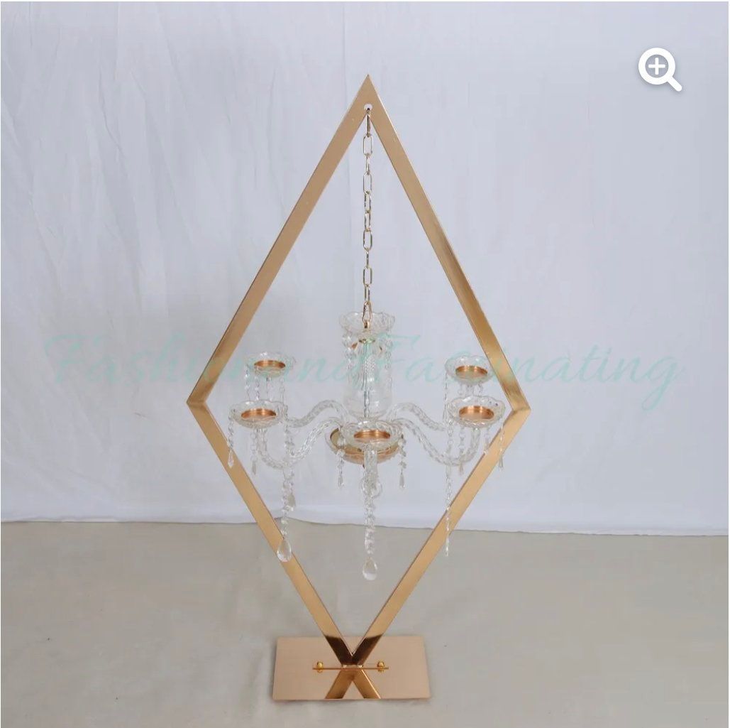 A diamond shaped chandelier is sitting on a table.