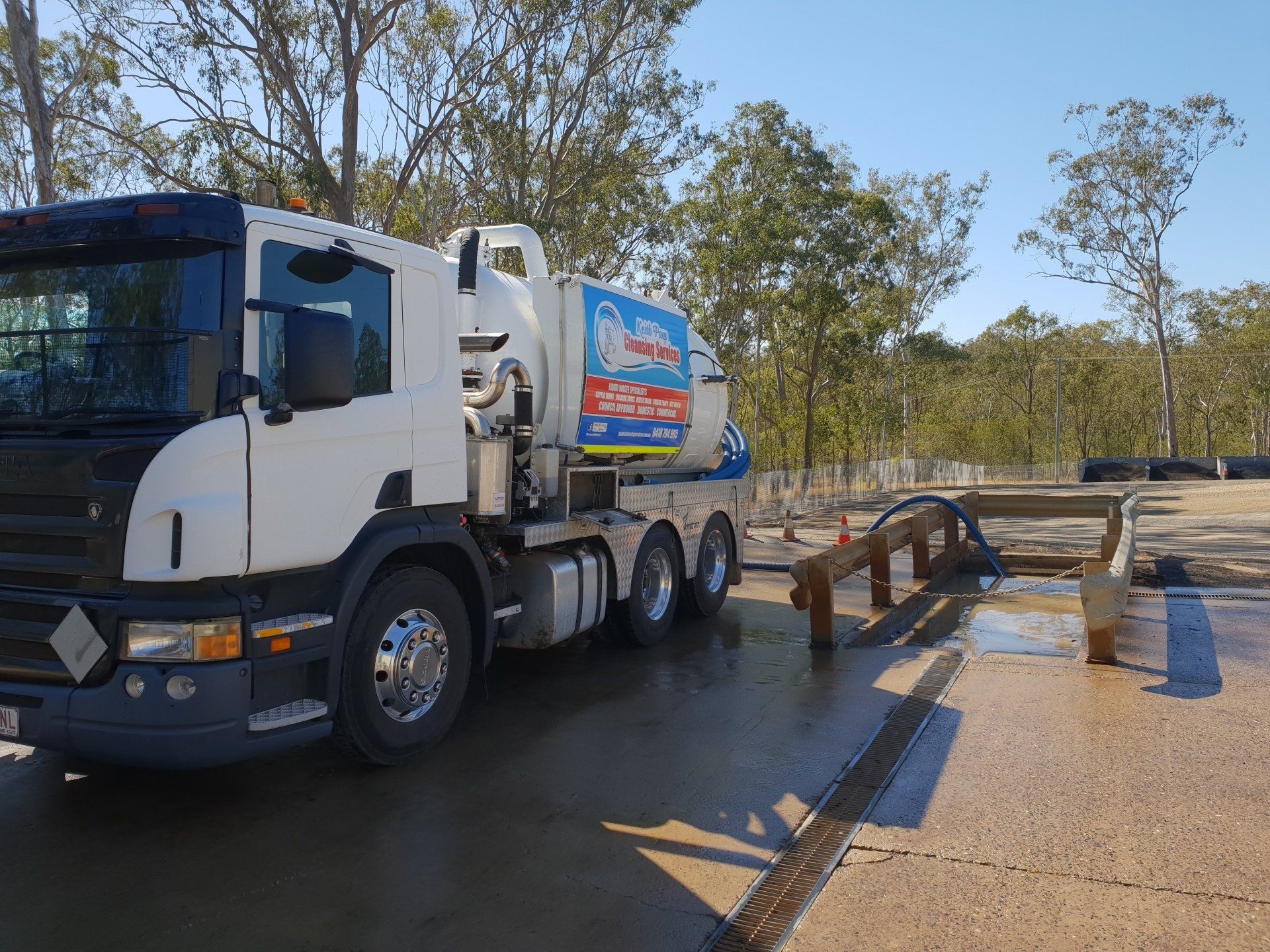 A White Truck Is Parked On The Side Of The Road — Paap's Cleansing Services In Branyan, QLD