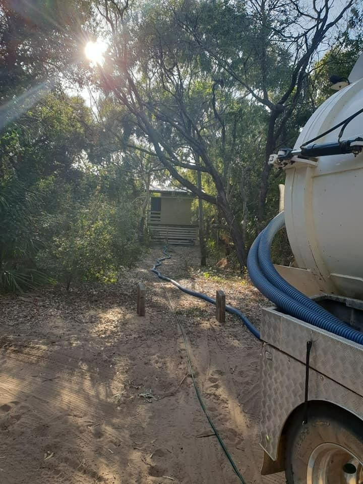 A Septic Tank Is Attached To The Back Of A Truck — Paap's Cleansing Services In Childers, QLD