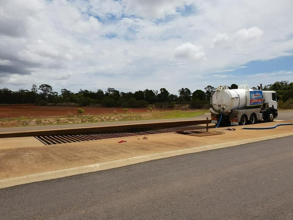 A White Truck Is Parked On The Side Of The Road — Paap's Cleansing Services In Gin Gin, QLD