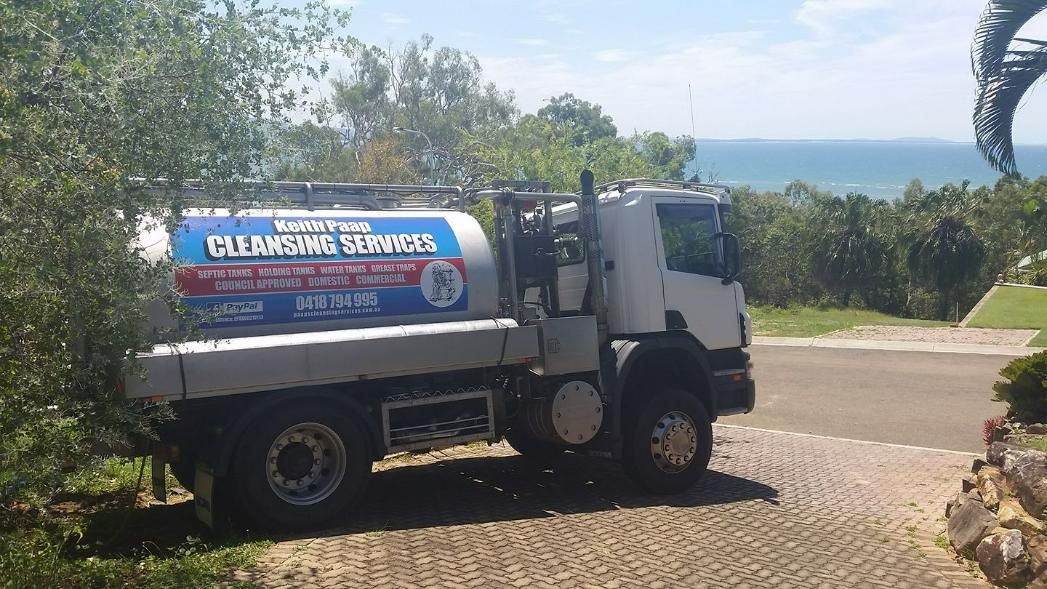 A White And Blue Truck Is Parked On The Side Of A Road — Paap's Cleansing Services In Gin Gin, QLD