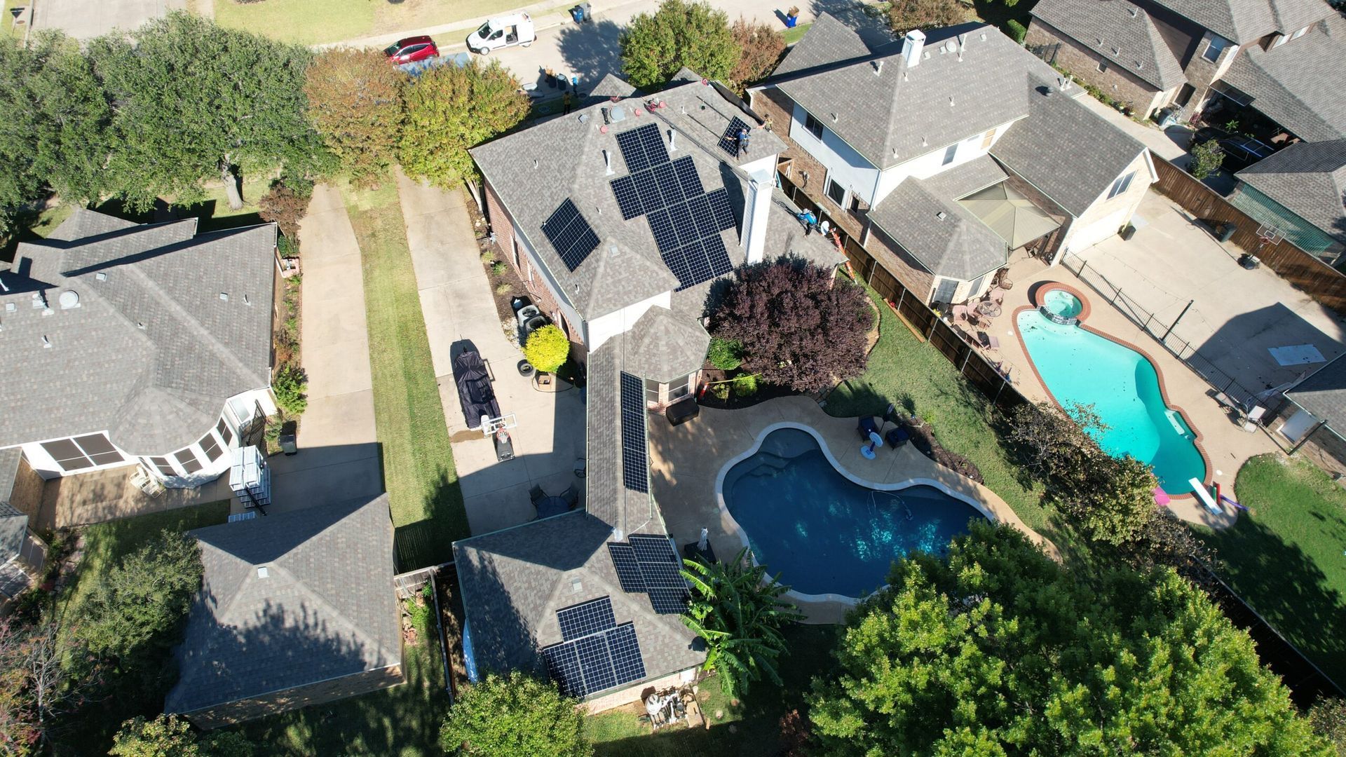 Aerial view of a house with solar panels 
