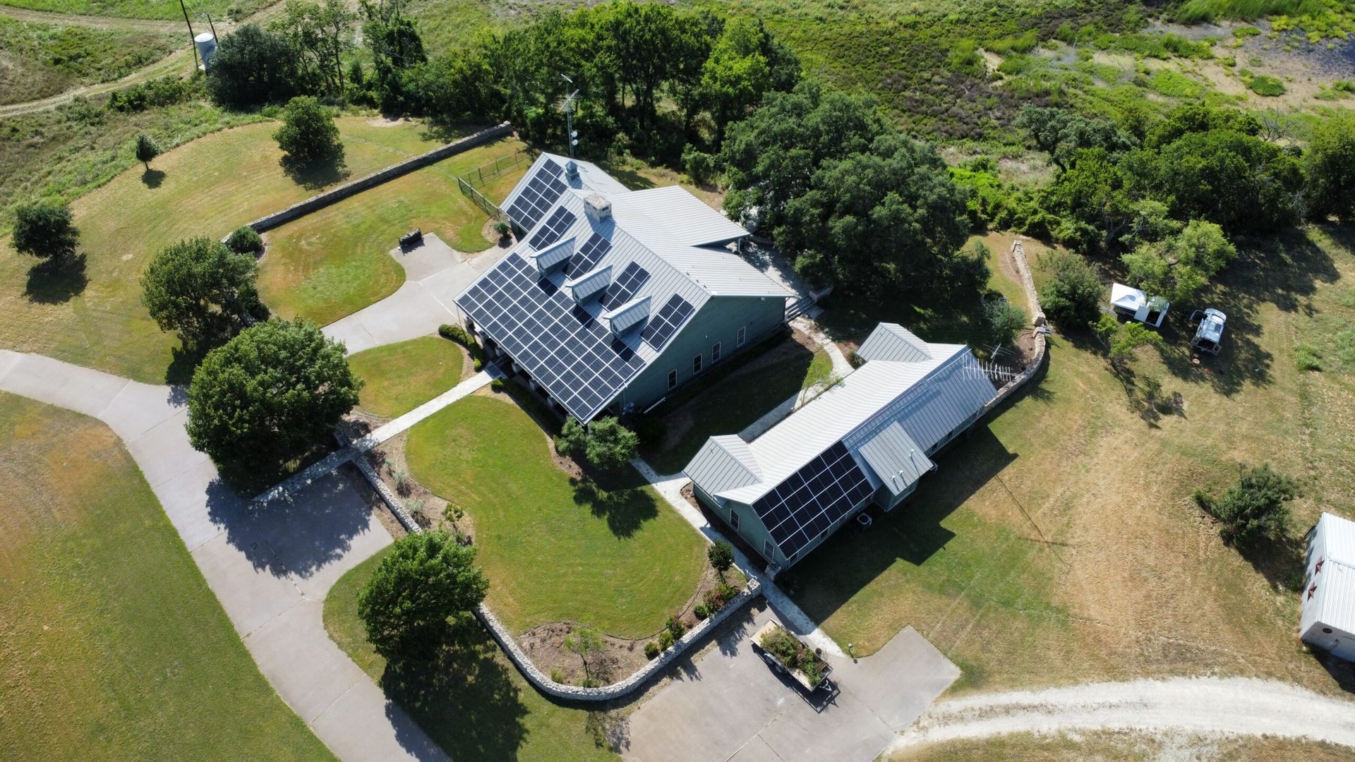Aerial view of a building with solar panels on the roof