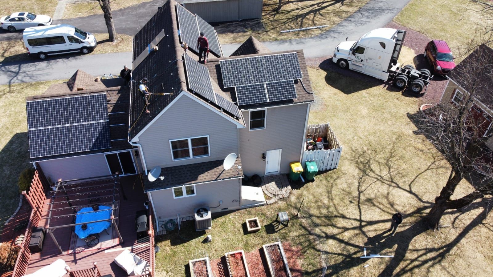 An aerial view of a house with solar panels