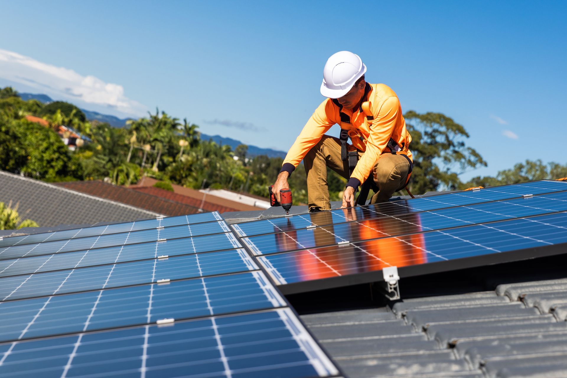 Solar panel installer on a roof