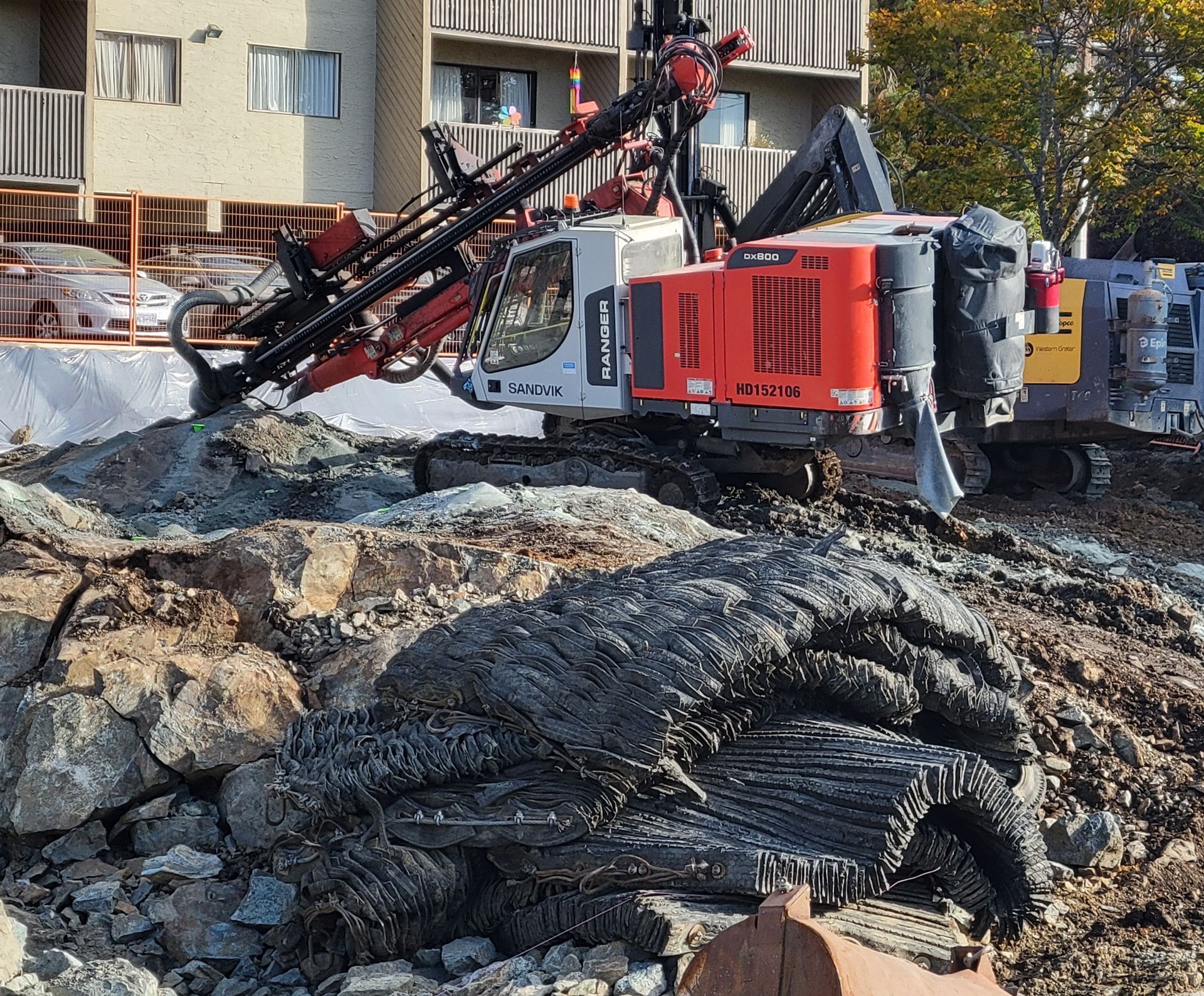 drilling to break up rock for a building foundation
