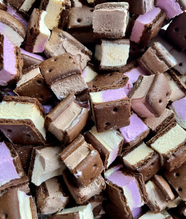 A pile of chocolate and purple ice cream cubes