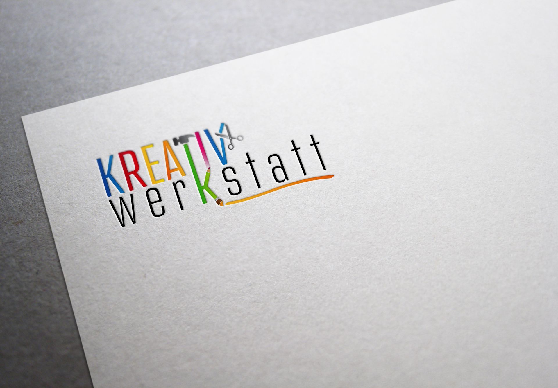 Ein Zettel mit der Aufschrift „kreativ werkstatt“