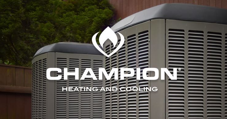 A champion heating and cooling logo is on the side of a building.