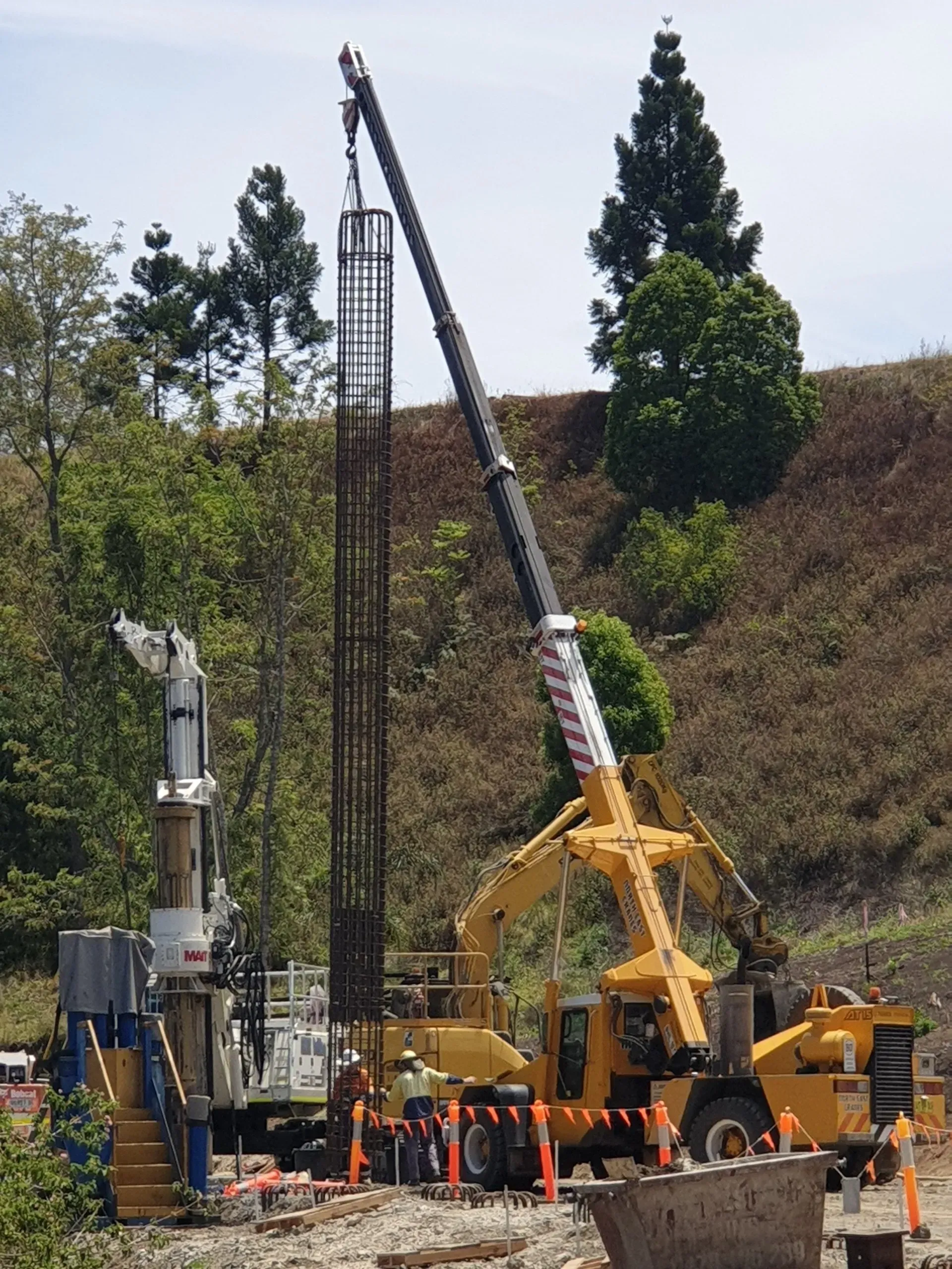 A construction site with a crane and a truck