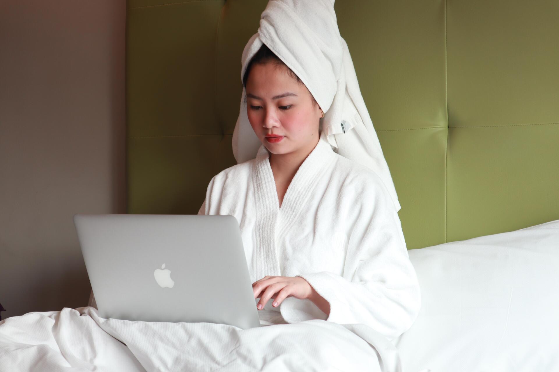 Shangri-La Plaza building facade at night with illuminated signage and palm tree.