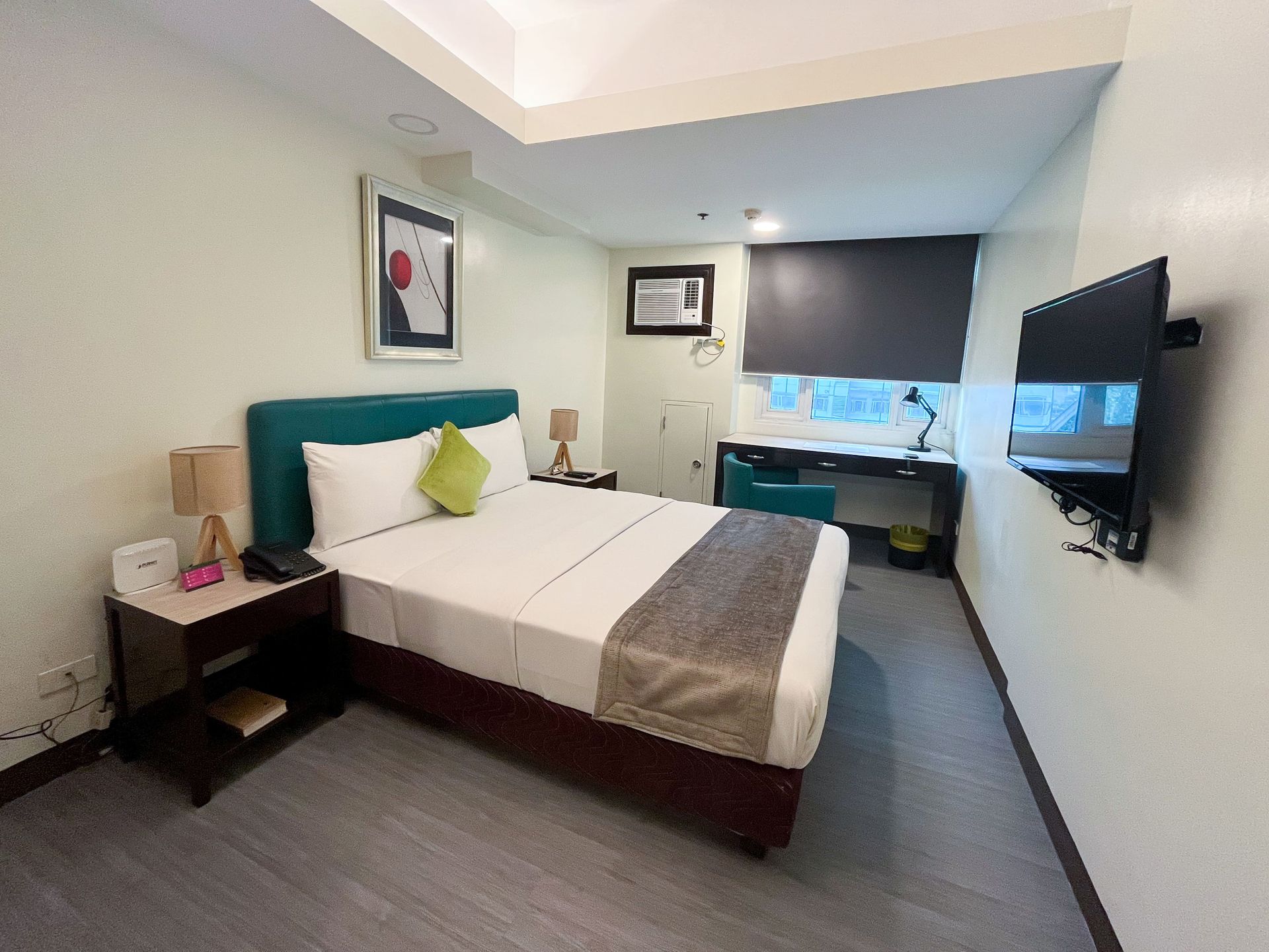 A room with tables and chairs set up for a wedding reception