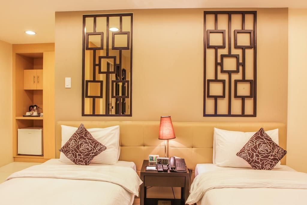 A kitchen counter with pots and pans and a blender on it.