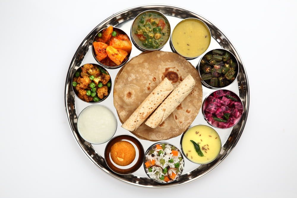 A Plate of Food With a Tortilla and Vegetables on It — Punjabi Sunrise Restaurant In Alexandra Hills, QLD