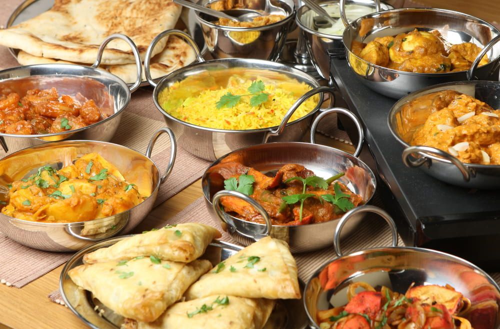 There Are Many Different Types Of Indian Food On The Table — Punjabi Sunrise Restaurant In Alexandra Hills, QLD