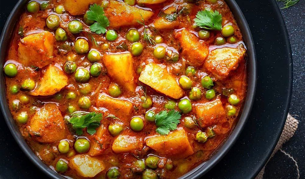 Potatoes and Peas Indian Dish with Spiced Curry