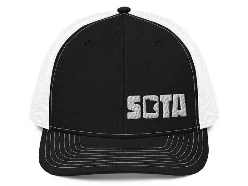 A black and white baseball cap with the word sota on it