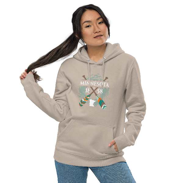 A woman wearing a hoodie that says minnesota on it