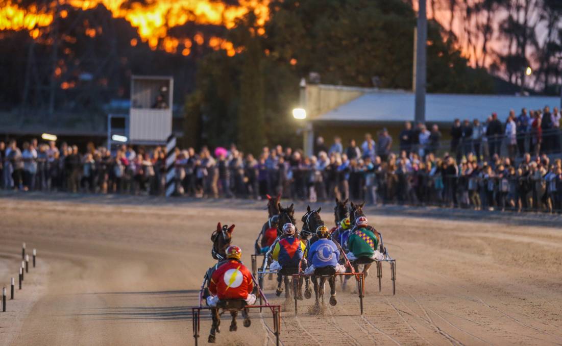 A race finishes as the sun sets