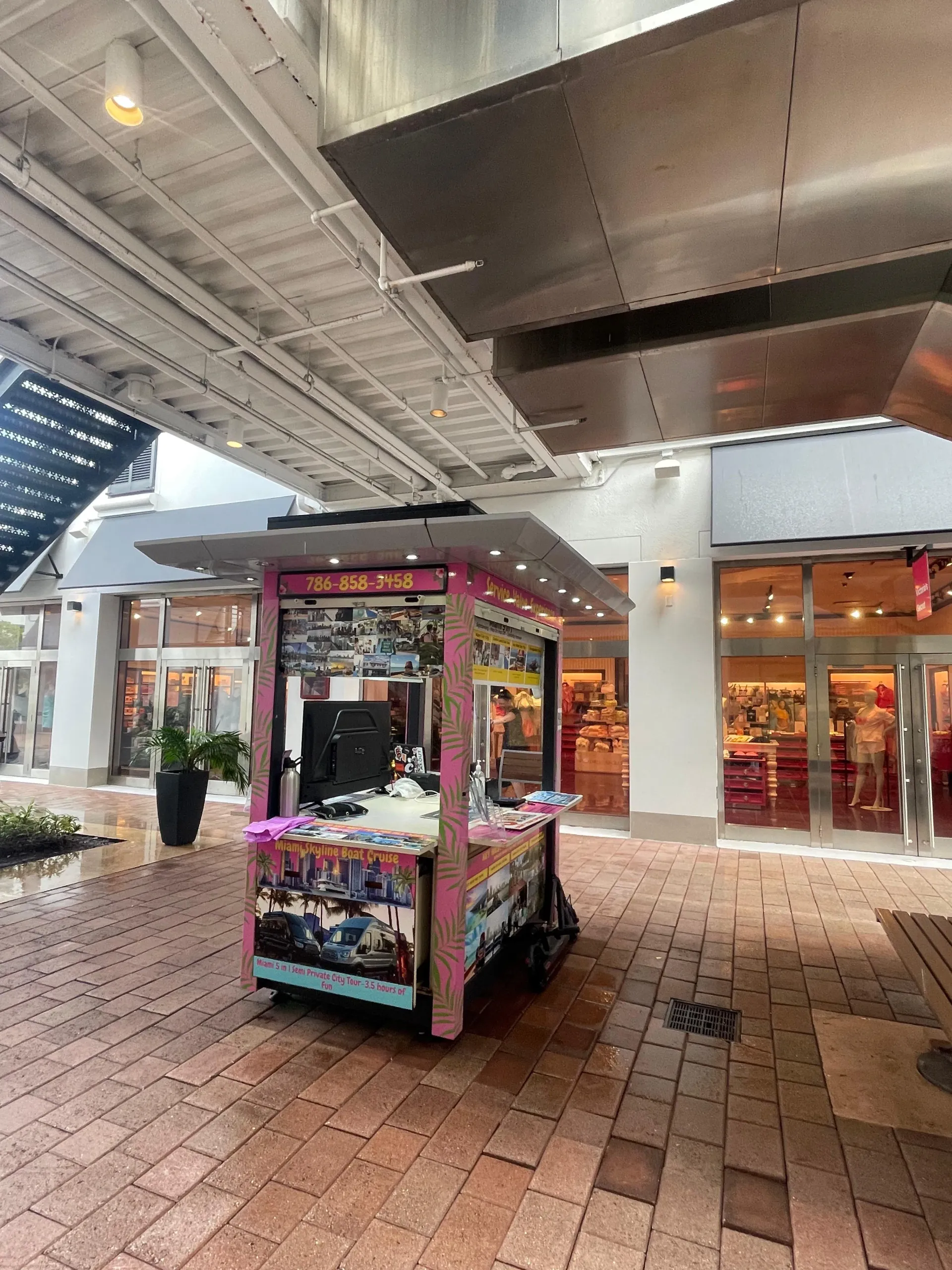 Bayside Marketplace check-in booth for Everglades tour from Miami with on-site team