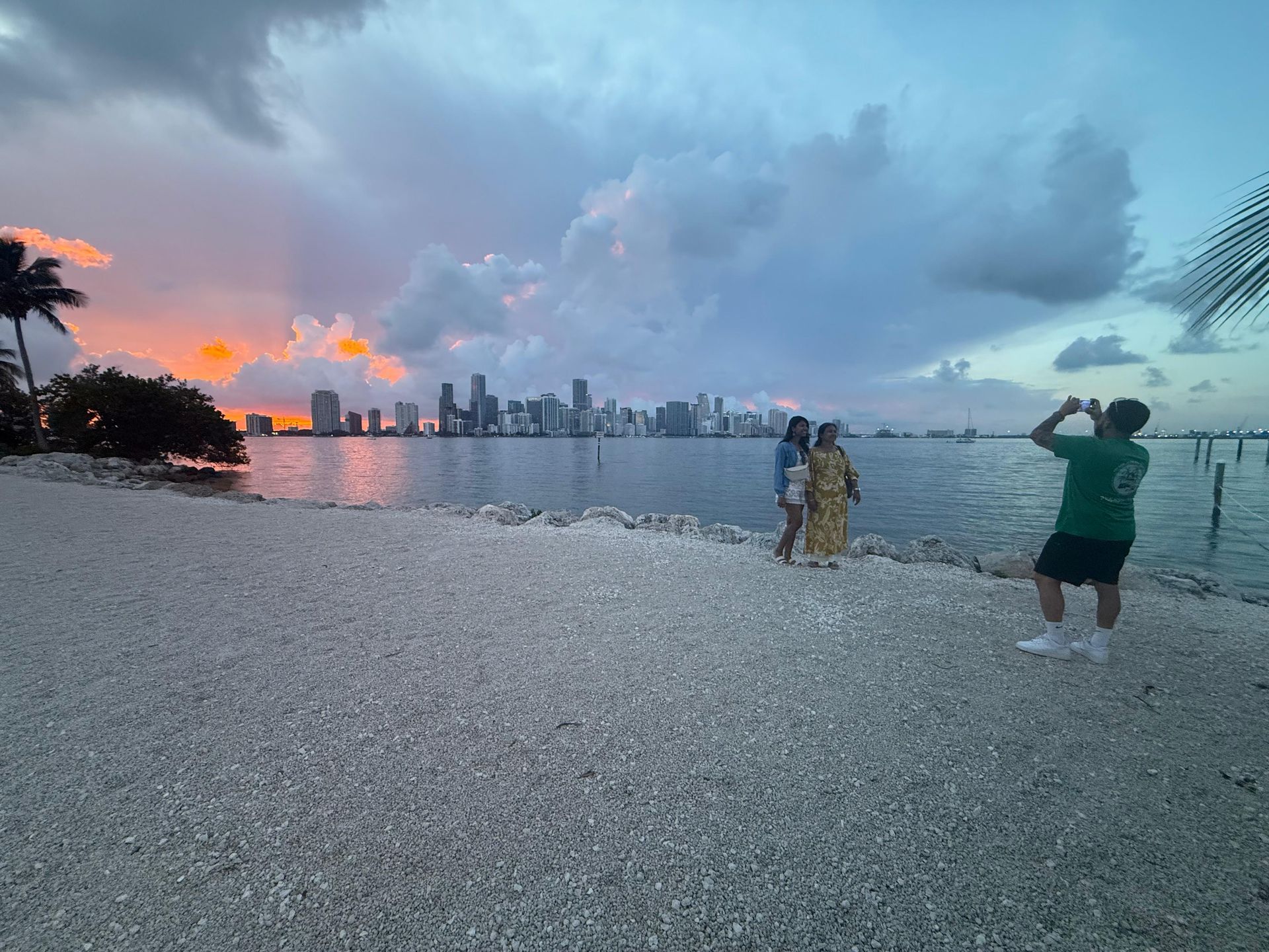 Tour guide taking photos of passengers at the Miami Skyline Sunset Place
