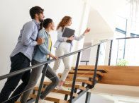 A group of people are walking up a set of stairs.