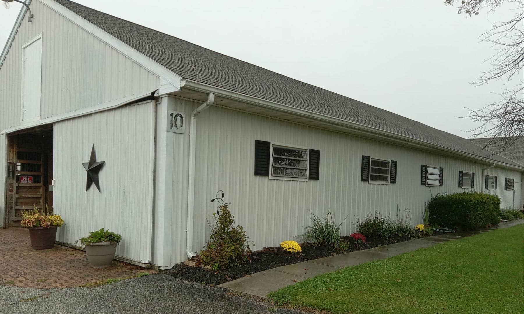 A horse is eating hay in a stable.
