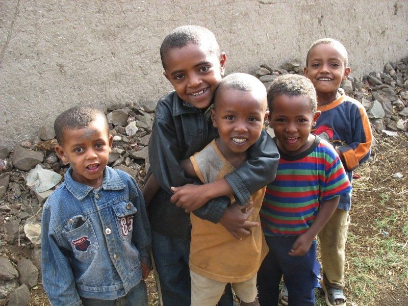 A group of young boys are posing for a picture