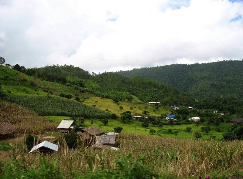 A small village in the middle of a lush green hillside
