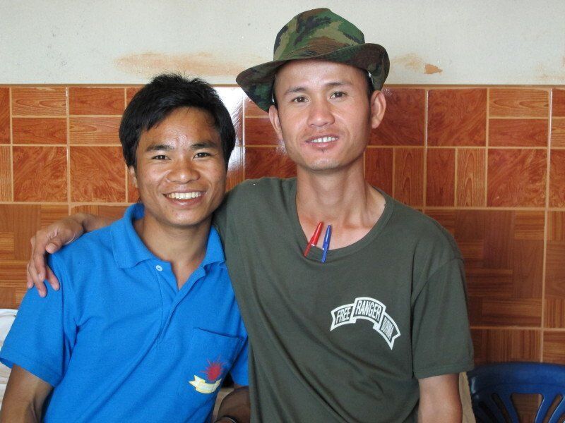 Two men posing for a picture with one wearing a shirt that says ' freedom ' on it