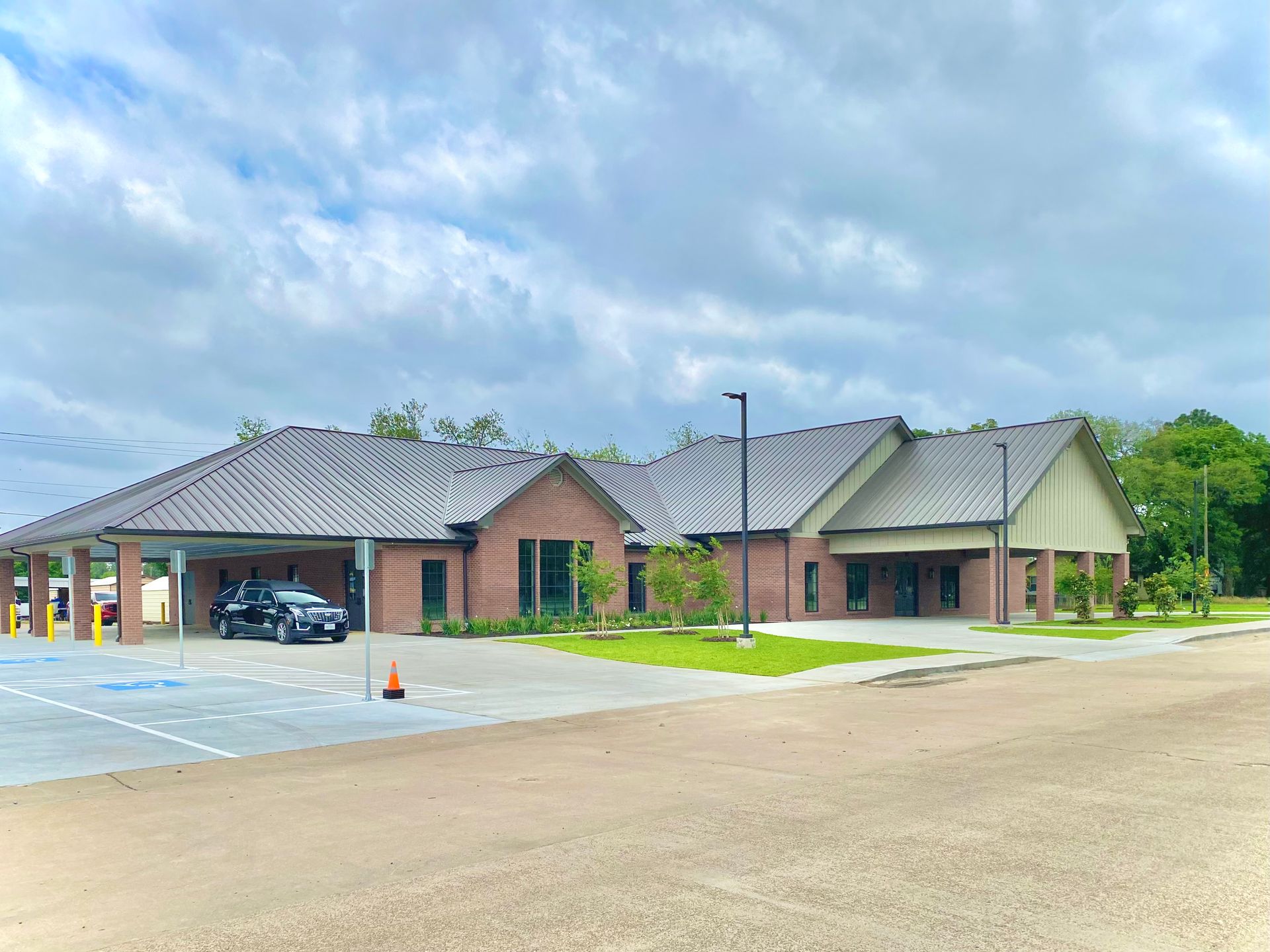 Sunset over the ocean with colorful sky reflected on the wet sand.