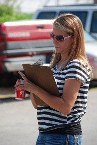 Woman Filling Up A Form — Nashville, TN — Mike’s Custom Towing