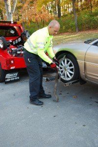 Man Towing Car — Nashville, TN — Mike’s Custom Towing