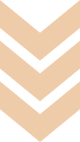 A series of three light tan, V-shaped chevrons pointing downward against a white background.