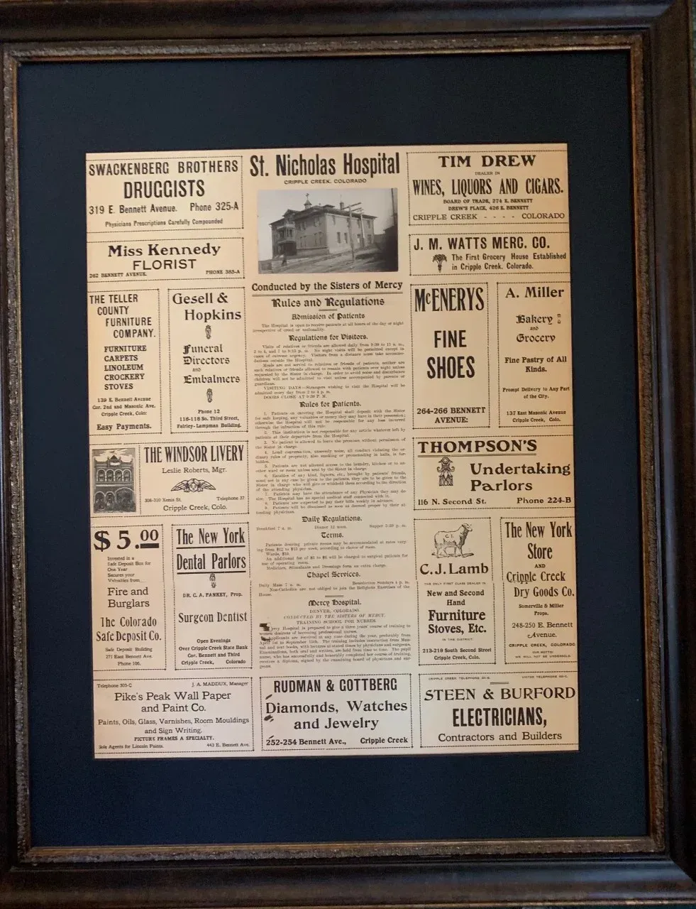 A framed page of a newspaper that says thompson 's undertakers
