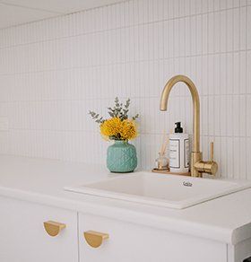 Gold Tap In Kitchen Sink — Interior Design in Tweed Heads, NSW