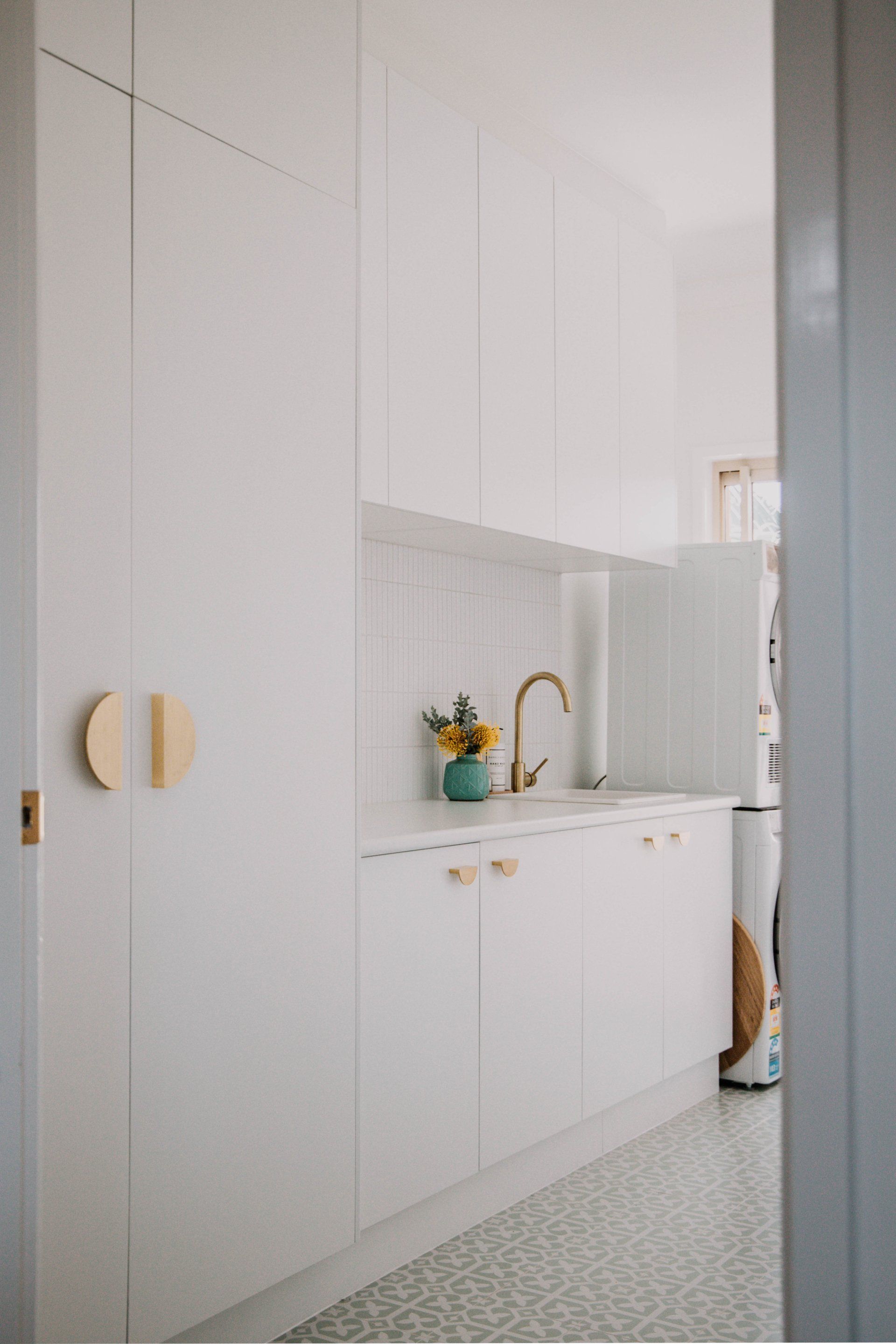 Elegant Laundry Interior With Sink And Cabinets — Interior Design in Tweed Heads, NSW