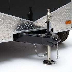 Black utility trailer with diamond plate front, jack, and tire.