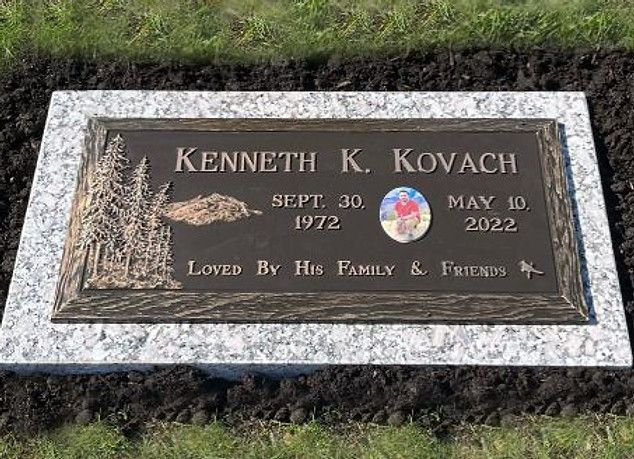 bronze plaque with a wilderness motif and glazed-porcelain image of the deceased