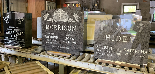 Two elegantly designed headstones show the variety of concepts