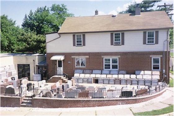 A brick house with a large patio in front of it