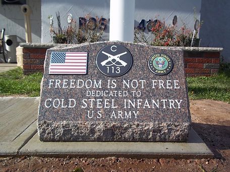 A stone plaque that says freedom is not free dedicated to cold steel infantry us army