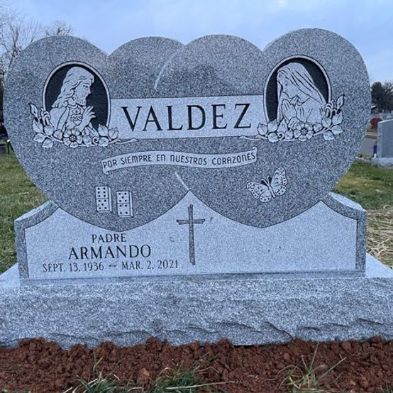 A grey granite heart-shaped headstone in Our Lady of Hungary Cemetery, Fords, NJ.