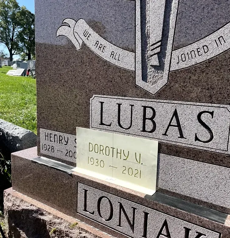 adding lettering to a tomb stone