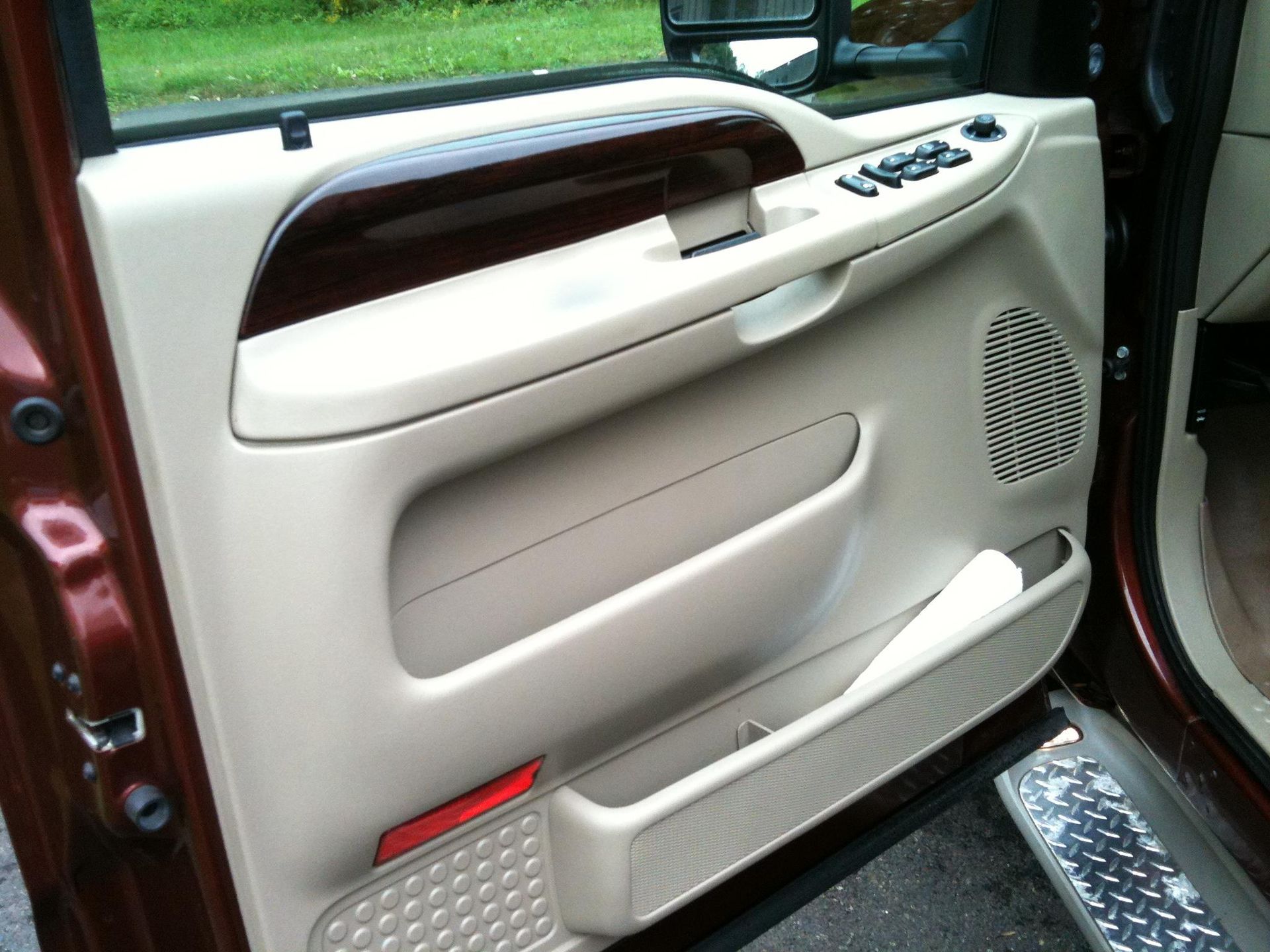 Black Ice Details & Coatings | close up of a car door with the word ford on it