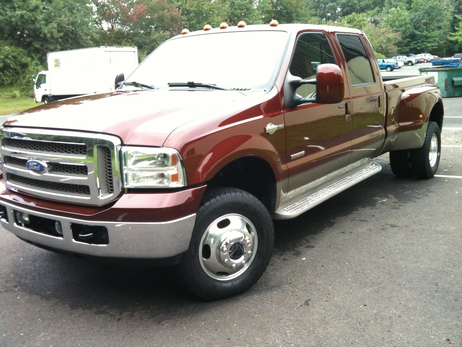 Black Ice Details & Coatings | red ford truck is parked in a parking lot